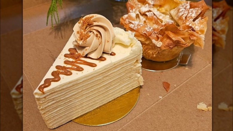 Mille crepe slice beside another flaky pastry