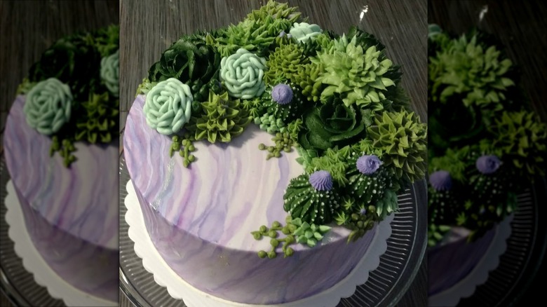 Circular marbled cake with succulent-inspired decorations