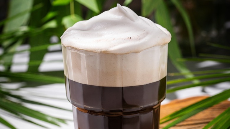Close-up of an iced coffee topped with cold foam