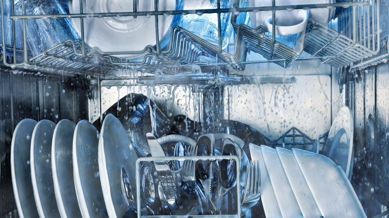 The inside of a dishwasher filled with dishes