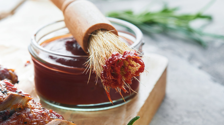 BBQ sauce in dish with brush
