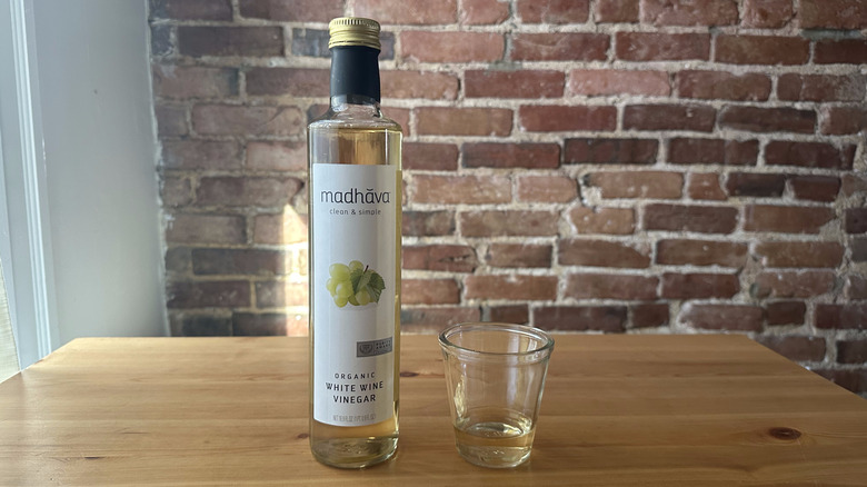 Madhava Organic White Wine Vinegar on wooden table