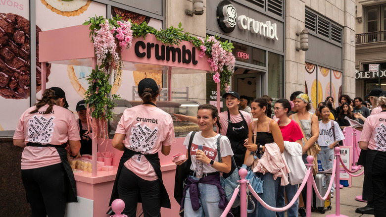 Customers in Crumbl Cookie store