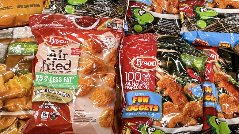 Bags of Tyson Foods chicken products in a grocery store display