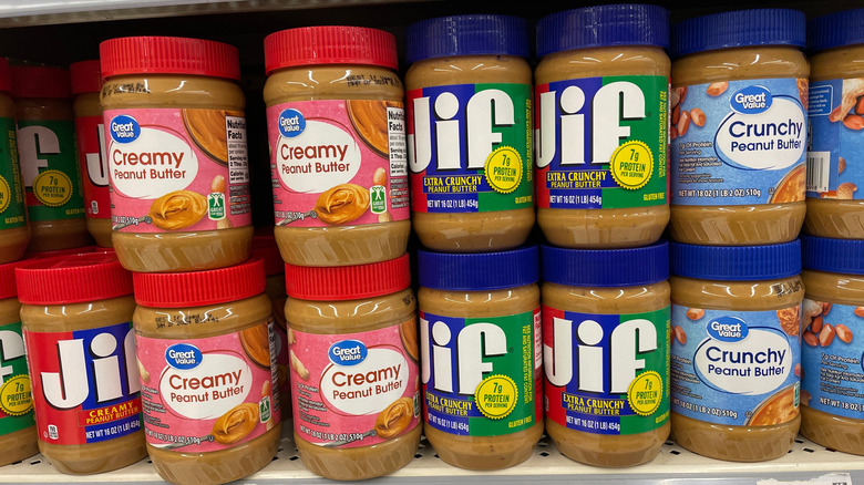 jars of Great Value and Jif peanut butters on shelf