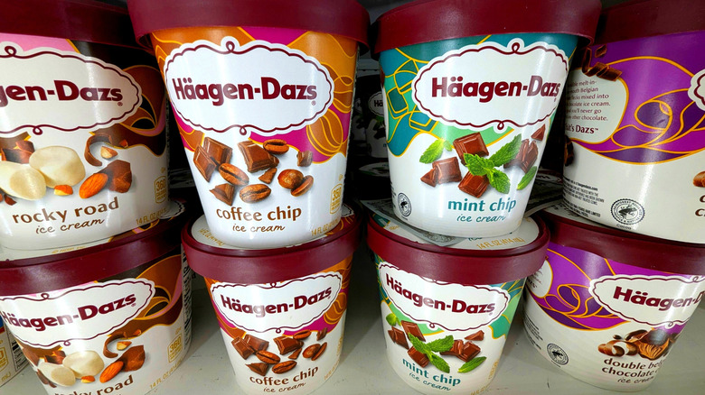 Cartons of Häagen-Dazs stacked in a grocery store freezer