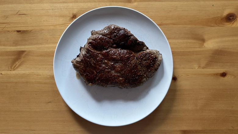 cooked top sirloin on a white plate