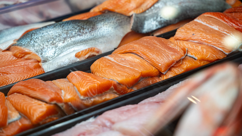 selection of salmon at grocery store