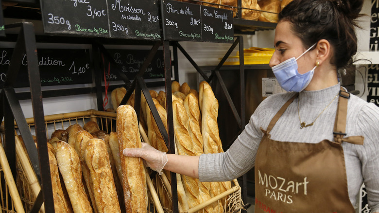 French baker with baguettes