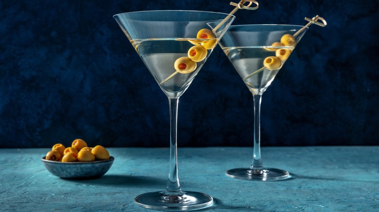 Two martinis with olives