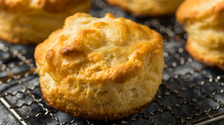 flakey buttermilk biscuits on a cooling rack