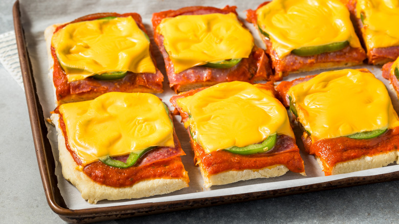 slices of homemade Altoona-style pizza topped with salami, green bell pepper, and American cheese