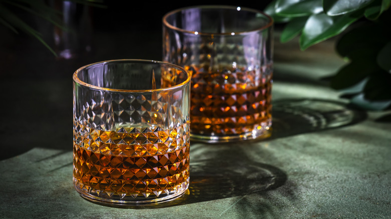 Two bourbon whiskey rock glasses.
