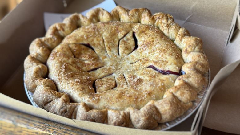 Apple pie in bakery takeout box