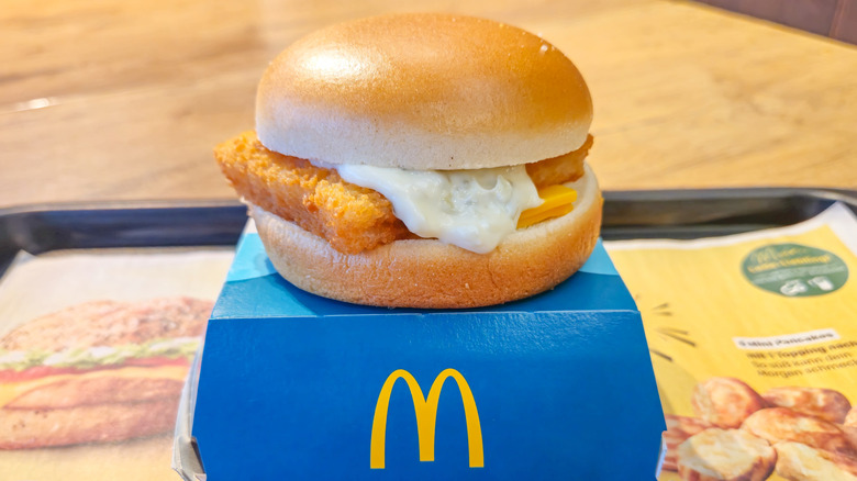 A McDonald's Filet-O-Fish sandwich on top of a box