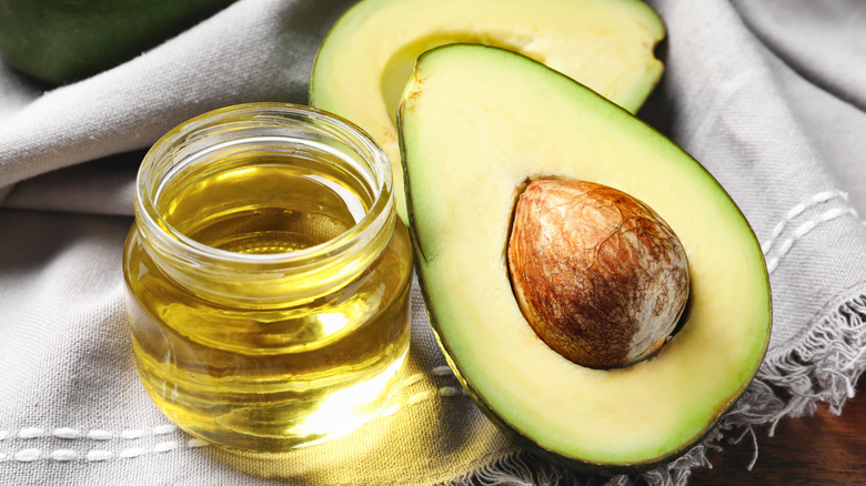 avocado with jar of oil