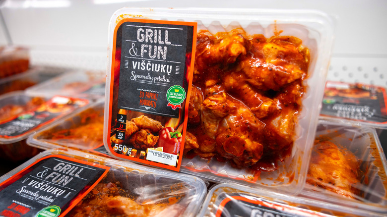 Prepackaged, marinated chicken in the refrigerated section