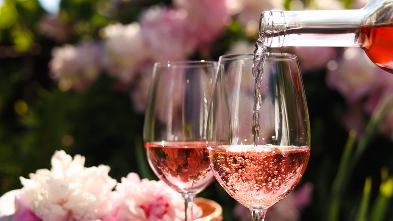 pouring glasses of rose wine