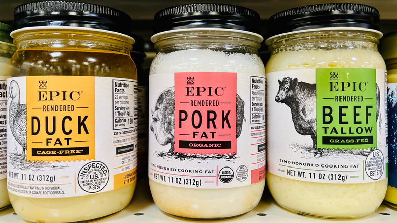 Jars of store-bought duck fat, pork fat, and beef tallow no shelf