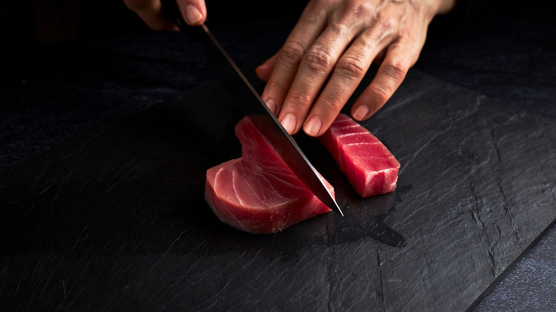 Person slicing bluefin tuna 