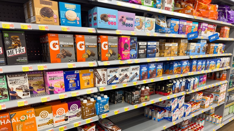 Boxes of protein bars on a grocery store shelf