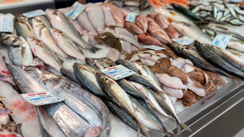 whole fish on ice at fish market