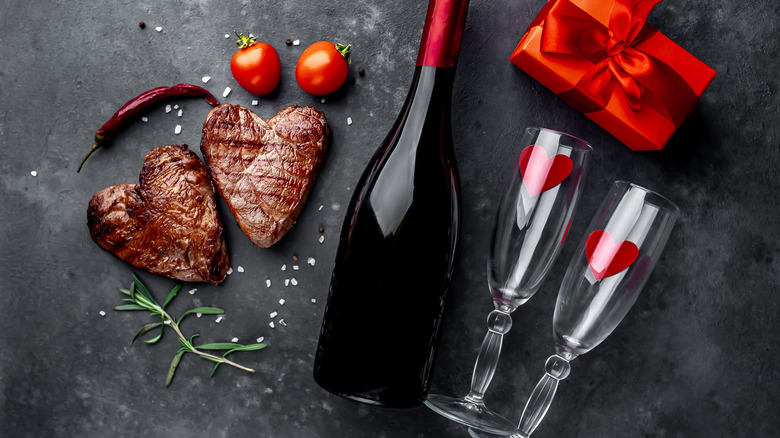Heart shaped steaks with champagne