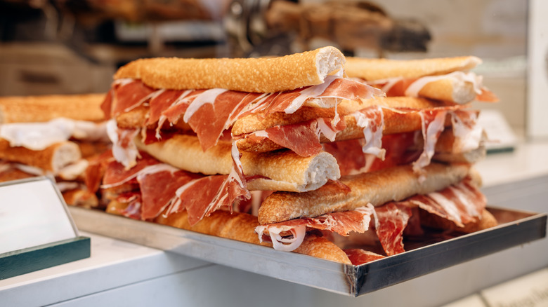 Stack of charcuterie sandwiches on a table