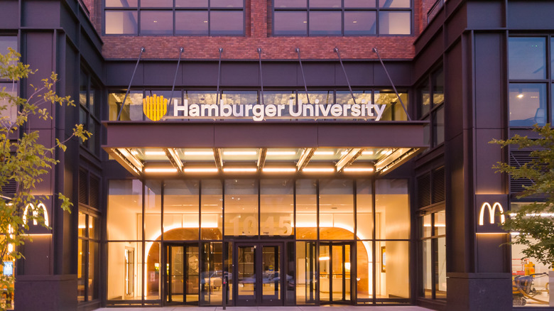 McDonald's Chicago headquarters with a modern-looking building and signs for "Hamburger University" as well as the golden arches.