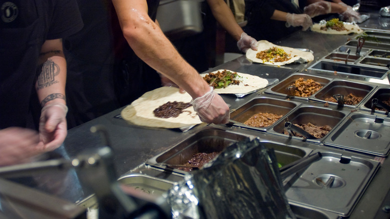 Chipotle employees making food