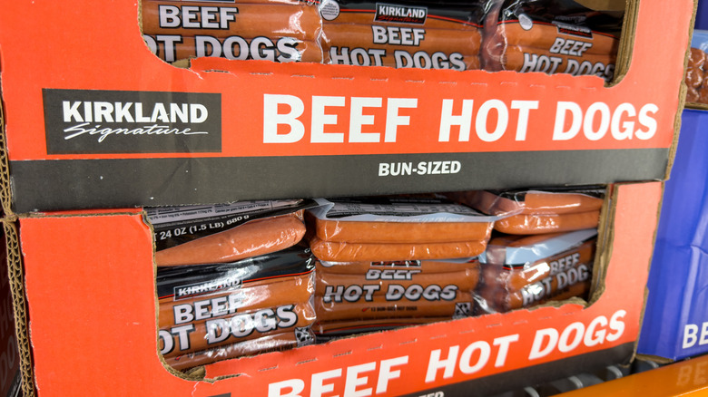 A cardboard case of Kirkland Signature beef hot dogs