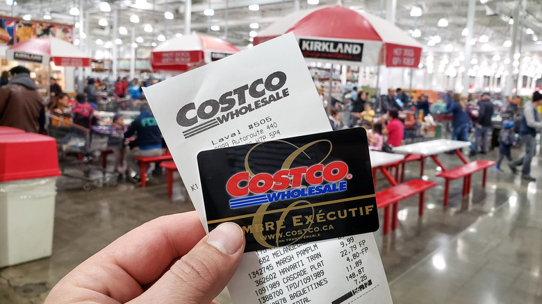 Member with a Costco card and a receipt