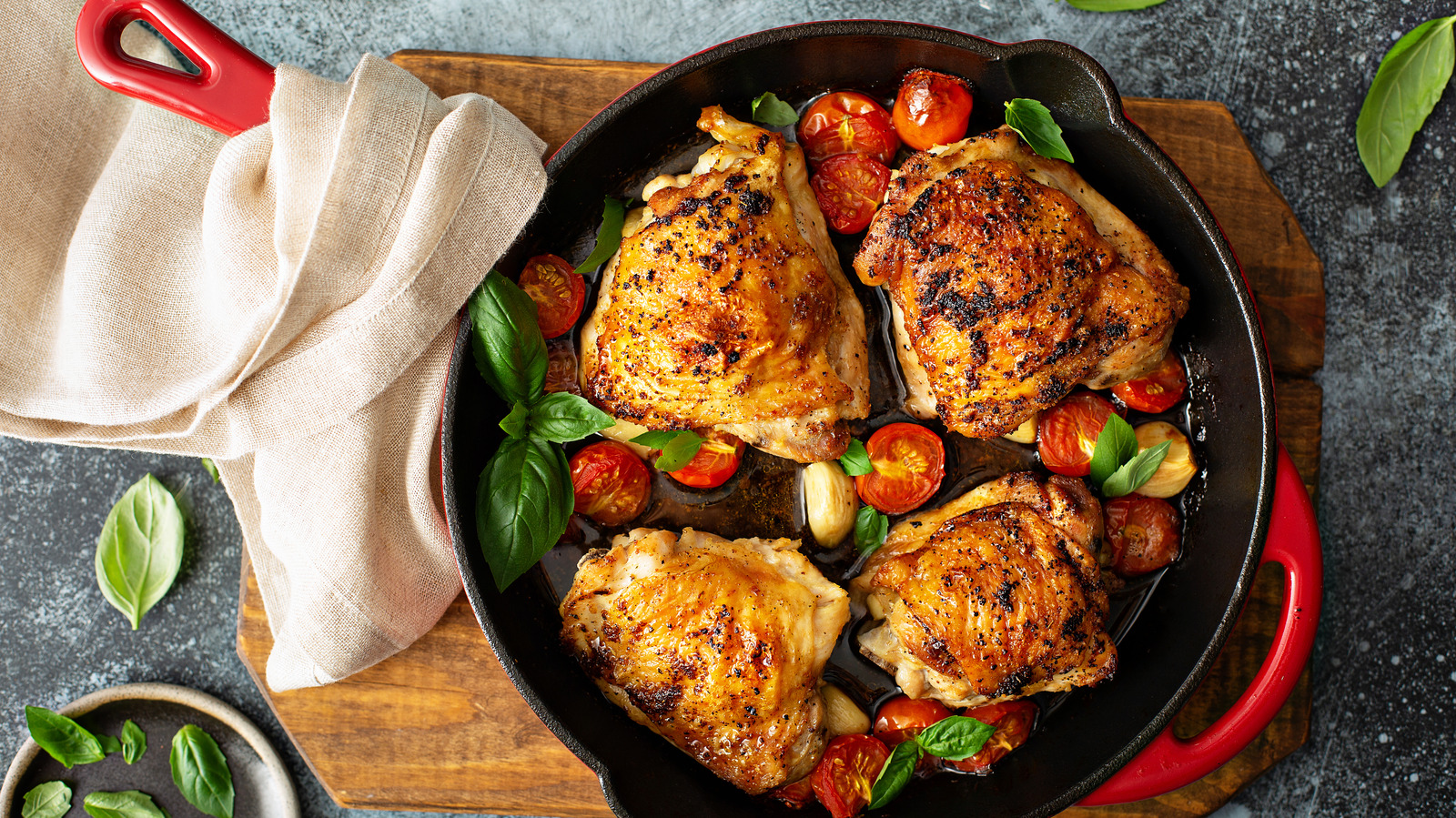 Why Covering The Pan When Cooking Chicken Thighs Is A Major Mistake