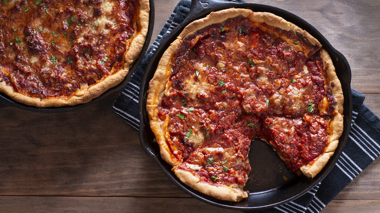 Two Chicago deep dish pizzas side by side