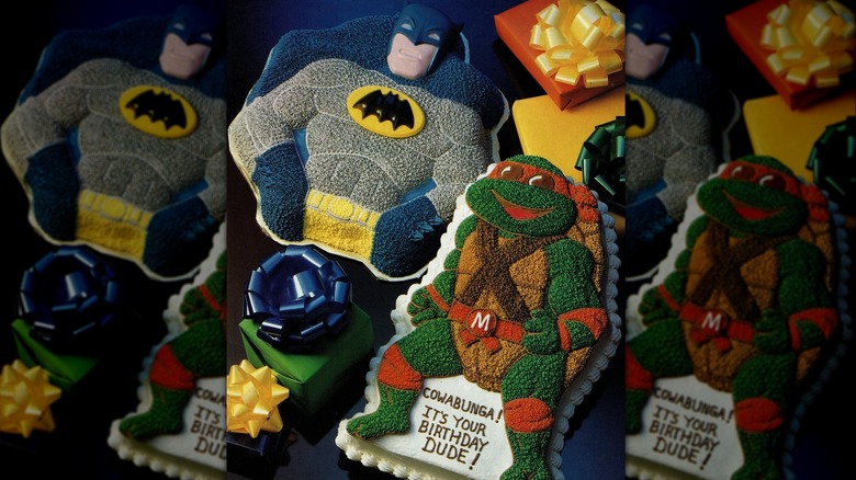 Wilton character cakes shaped and decorated like Batman and a Teenage Mutant Ninja Turtle