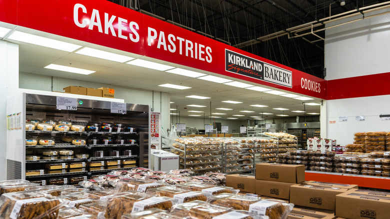 Kirkland Signature bakery inside Costco store with red sign and various baked goods on display