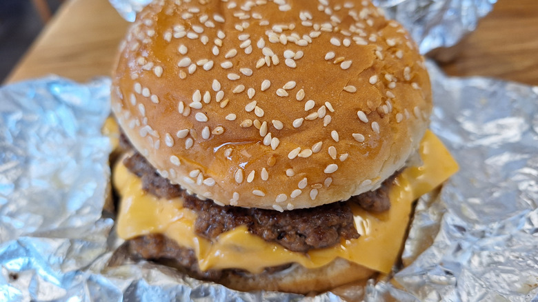 Five Guys burger in a foil wrap