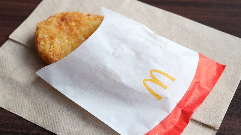 A white bag containing a McDonald's hashbrown