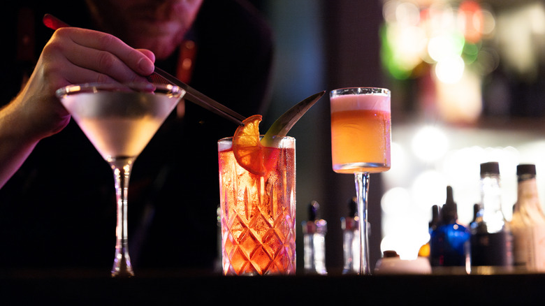 row of cocktails on a bar