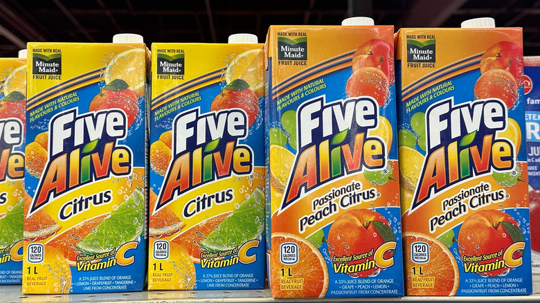 Rows of Five Alive Citrus juice cartons on a shelf