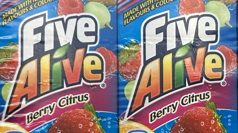 A closeup of two cartons of Five Alive Berry Citrus juice in plastic wrapping