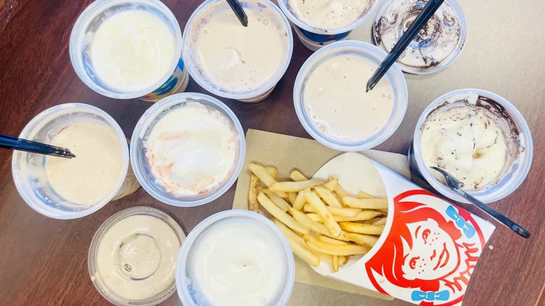 Various Wendy's Frosty flavors around fries
