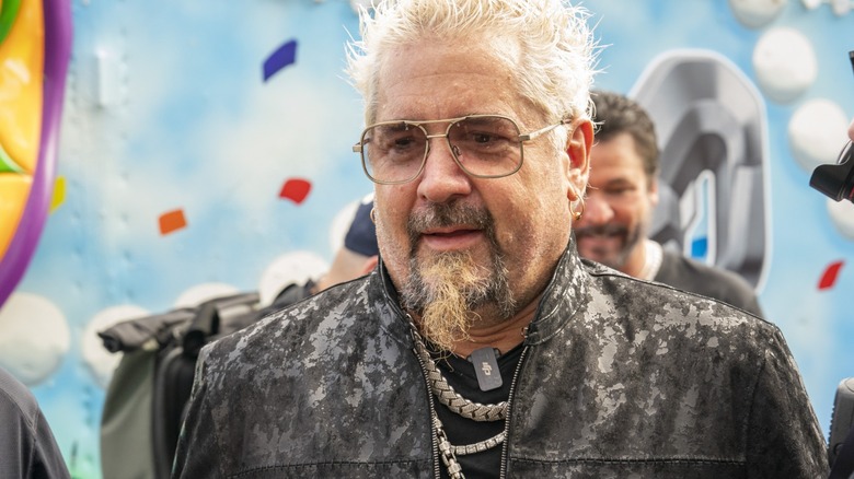 guy fieri in a mottled grey jacket