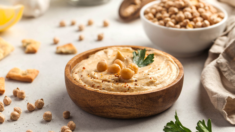 Hummus in a wooden bowl
