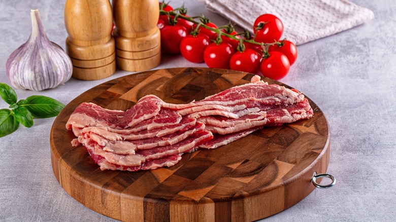 raw bacon waiting to be sizzled