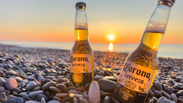 sunset on two Corona beers on a beach