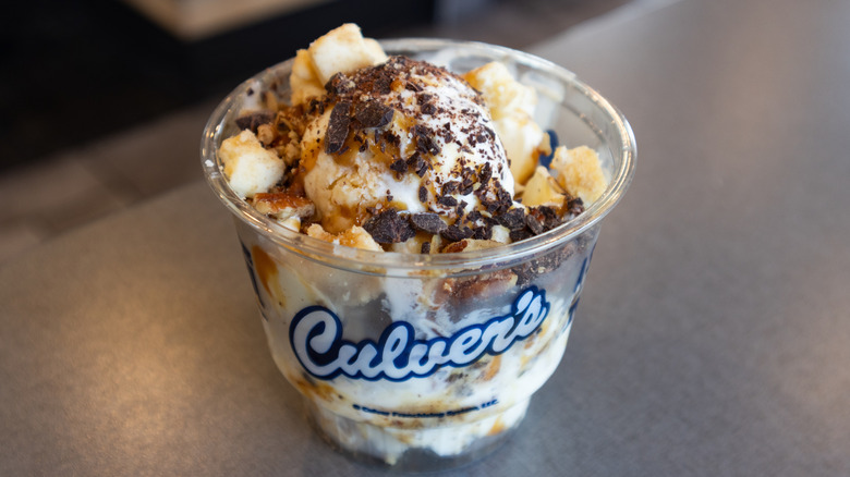 Culver's vanilla custard with caramel and chocolate pieces in plastic cup