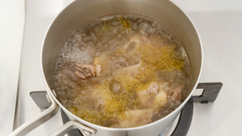 Ribs boiling in a pot