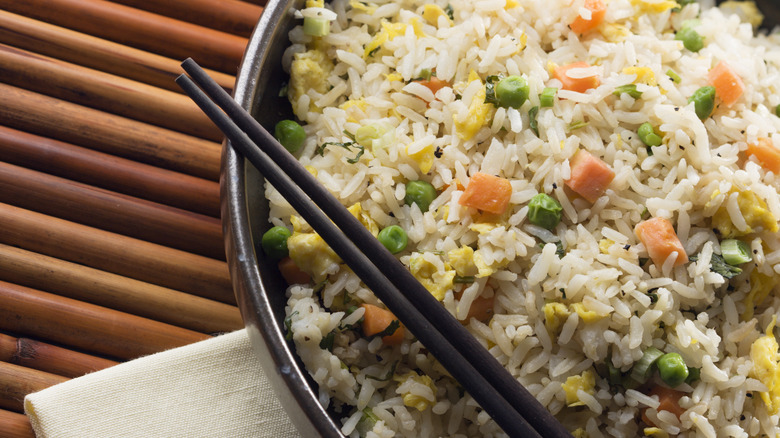 bowl of fried rice with chopsticks