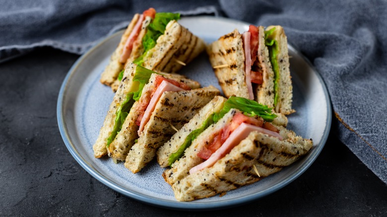 Plate of sliced sandwiches